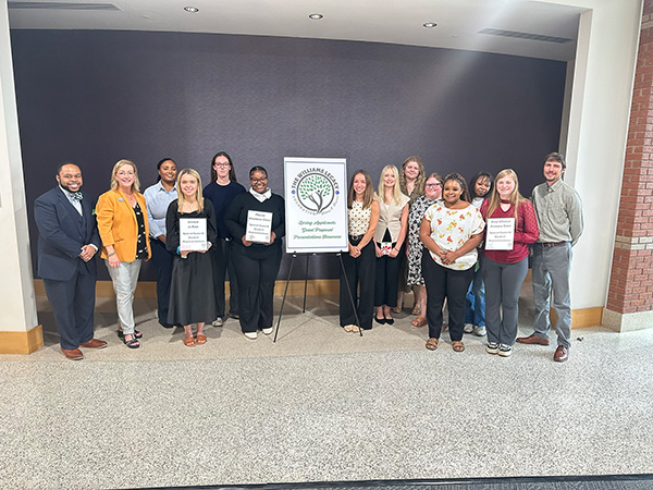 Group photo of faculty and staff with grant writing class.